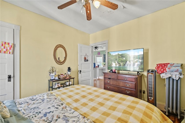 bedroom featuring hardwood / wood-style floors and ceiling fan