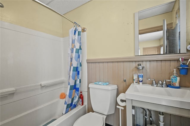 bathroom featuring toilet, wood walls, and shower / bath combo with shower curtain