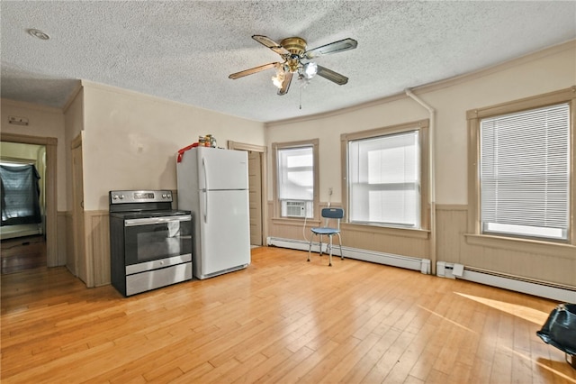 kitchen featuring electric stove, white refrigerator, a textured ceiling, light wood-type flooring, and a baseboard heating unit