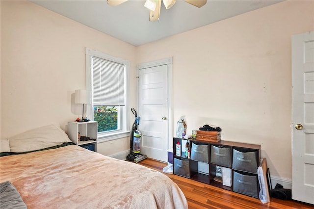 bedroom with hardwood / wood-style floors and ceiling fan