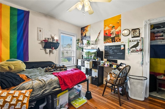 bedroom with wood-type flooring and ceiling fan