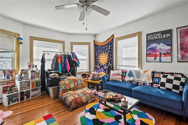 living room with hardwood / wood-style flooring and ceiling fan