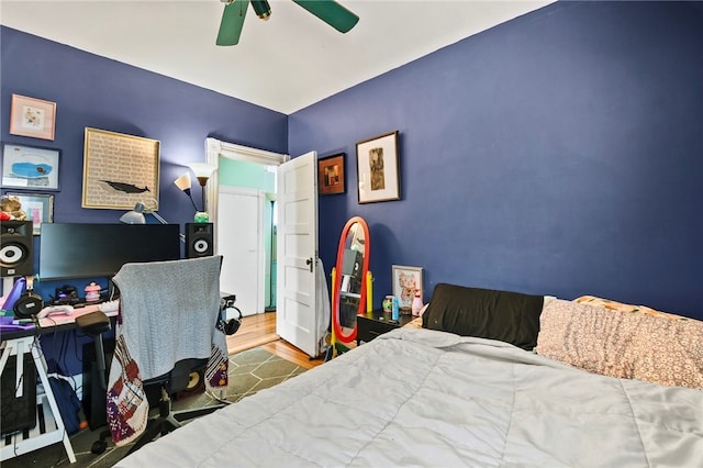 bedroom with hardwood / wood-style floors and ceiling fan