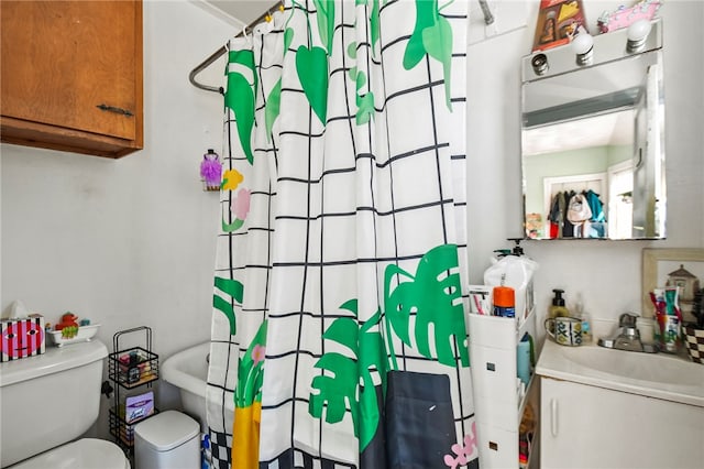 full bathroom featuring shower / bath combination with curtain, sink, and toilet