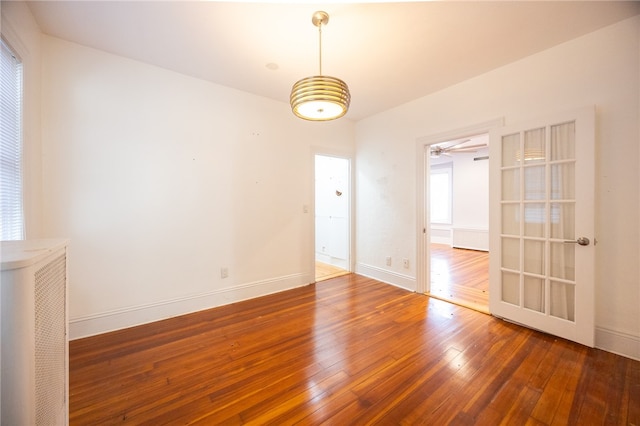 unfurnished room with dark wood-type flooring