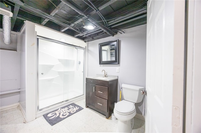 bathroom featuring walk in shower, vanity, and toilet