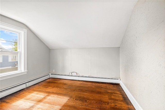 bonus room featuring wood-type flooring and vaulted ceiling