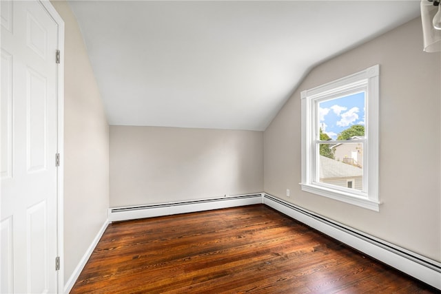 bonus room with dark wood-type flooring, a baseboard radiator, and lofted ceiling