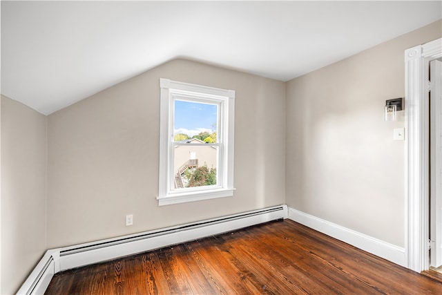 bonus room featuring dark hardwood / wood-style floors, baseboard heating, and vaulted ceiling