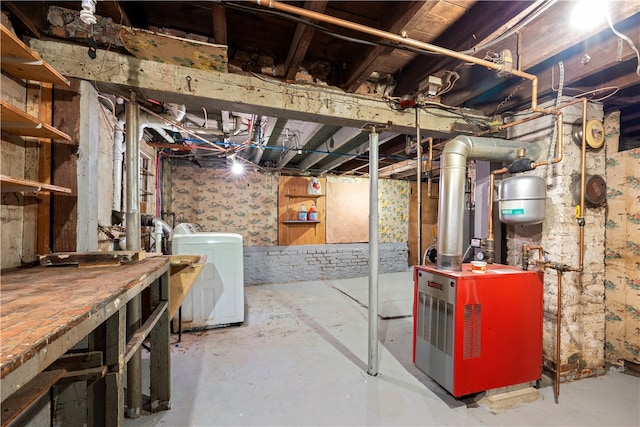 basement featuring washing machine and dryer and a workshop area