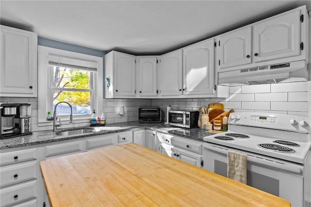 kitchen with backsplash, light stone counters, sink, electric stove, and white cabinetry