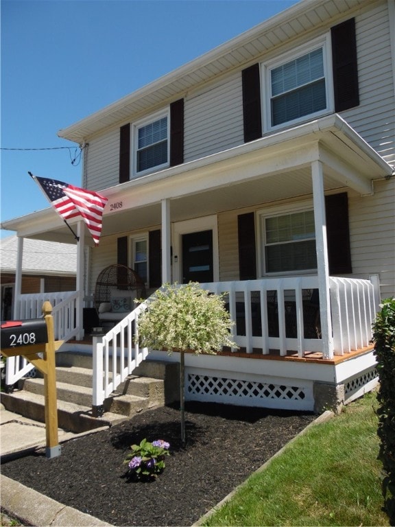 view of front of home featuring covered porch