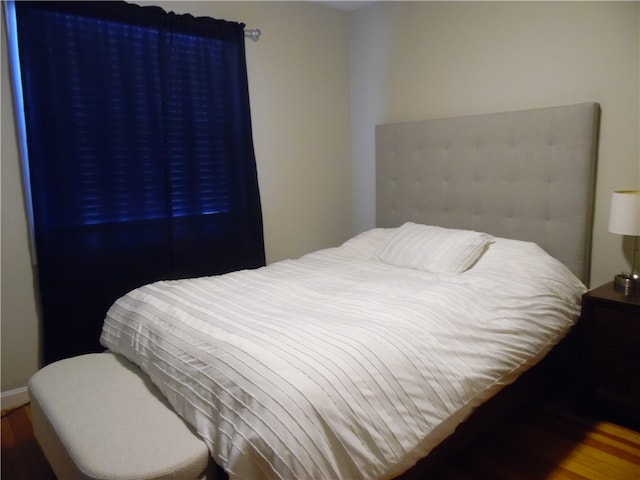 bedroom with wood-type flooring