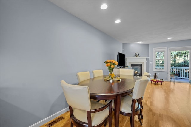 dining space featuring light wood-type flooring