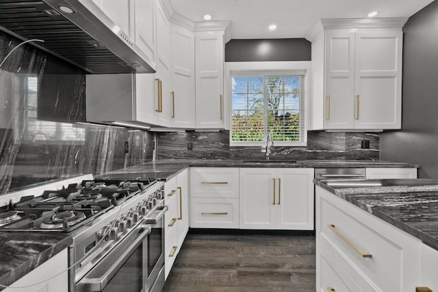 kitchen featuring white cabinetry, stainless steel range, and exhaust hood