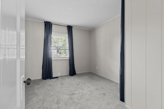 unfurnished room featuring light carpet and ornamental molding