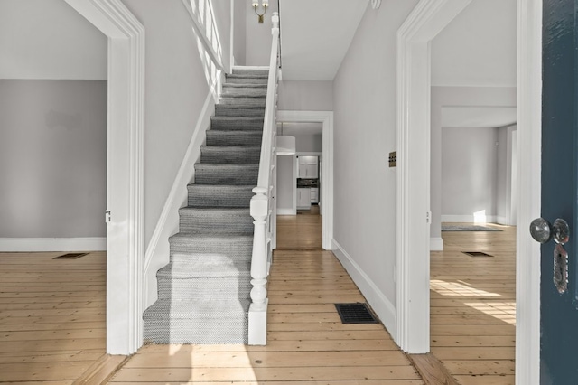 stairway with wood-type flooring