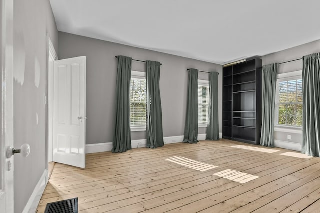 spare room featuring light hardwood / wood-style floors