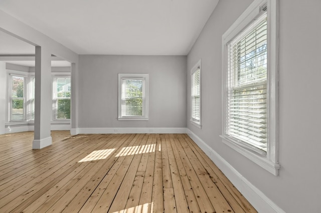 spare room featuring light wood-type flooring