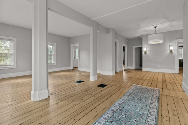 interior space featuring light wood-type flooring and a wealth of natural light