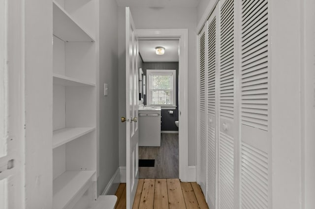 corridor featuring light hardwood / wood-style flooring