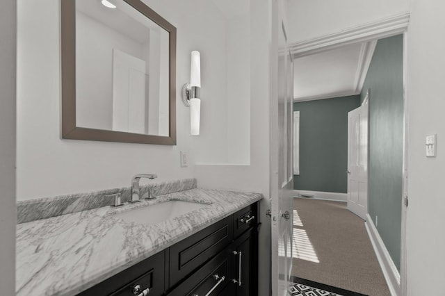 bathroom with vanity and ornamental molding