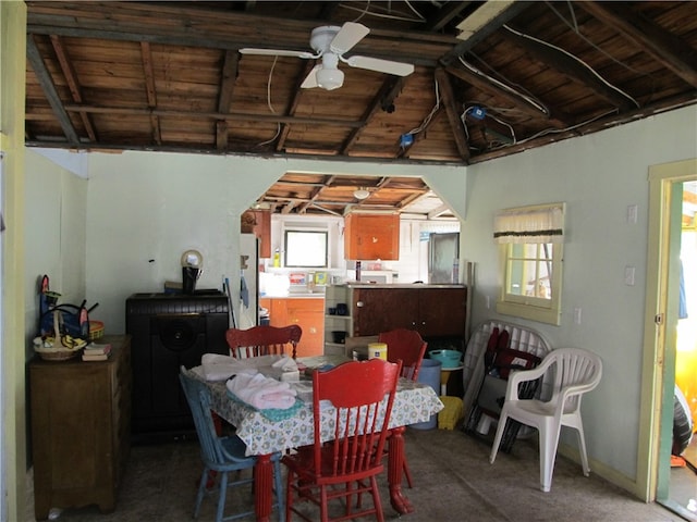 dining area with wooden ceiling, ceiling fan, plenty of natural light, and carpet floors