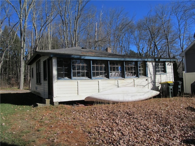 view of front of property featuring a sunroom