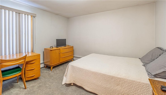 carpeted bedroom featuring baseboard heating