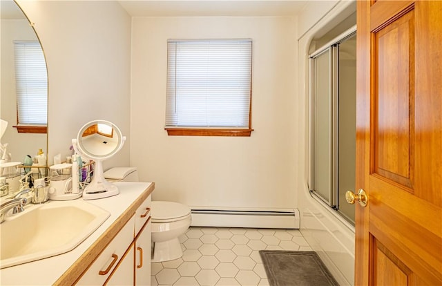 full bathroom with tile patterned floors, vanity, baseboard heating, shower / bath combination with glass door, and toilet