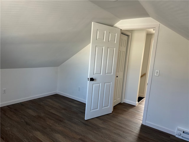 bonus room with dark hardwood / wood-style flooring and lofted ceiling