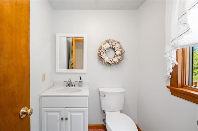 bathroom with vanity and toilet