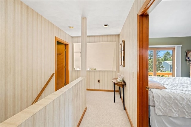 corridor with light colored carpet