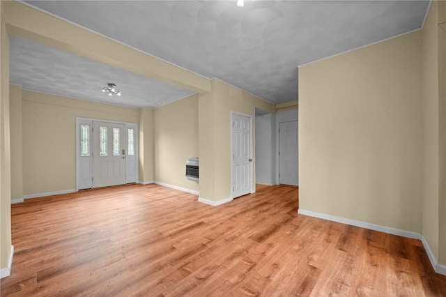 unfurnished living room with light hardwood / wood-style flooring