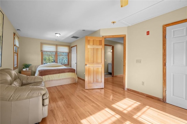 bedroom with hardwood / wood-style floors