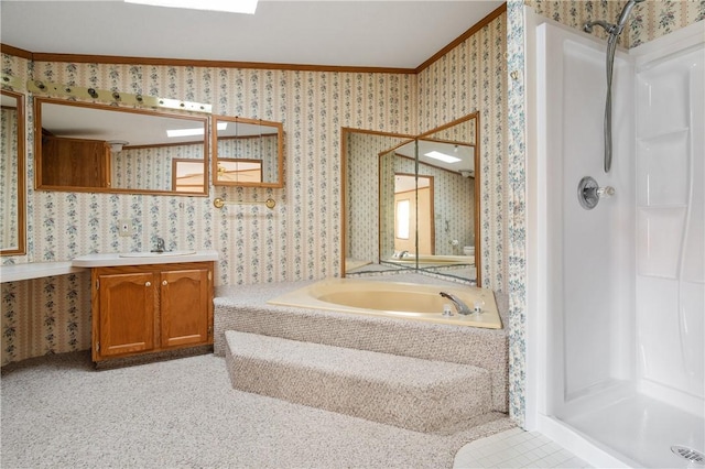 bathroom featuring vanity, ornamental molding, and shower with separate bathtub