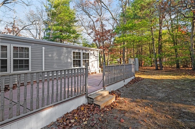 view of gate featuring a wooden deck