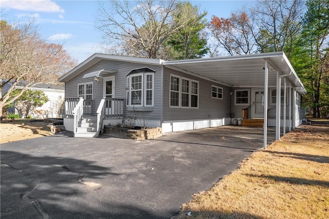 view of front facade with a carport