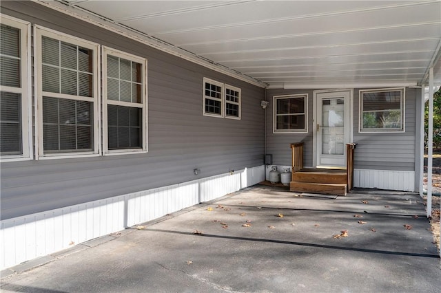 doorway to property with a patio