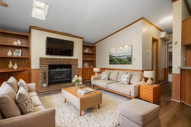 living room featuring dark hardwood / wood-style floors, ornamental molding, a fireplace, and vaulted ceiling