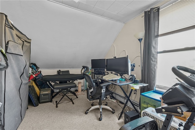 office space with light colored carpet and vaulted ceiling