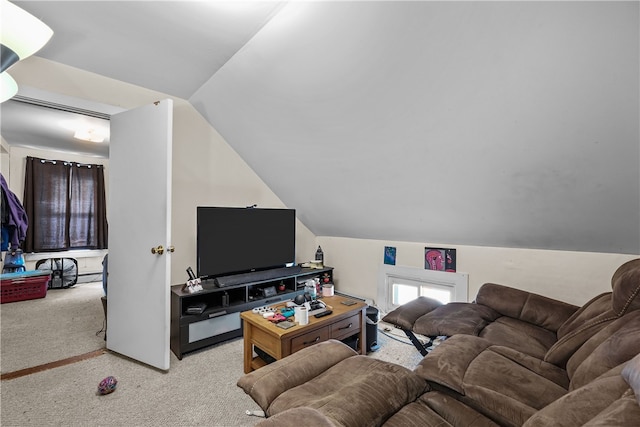 carpeted living room featuring lofted ceiling