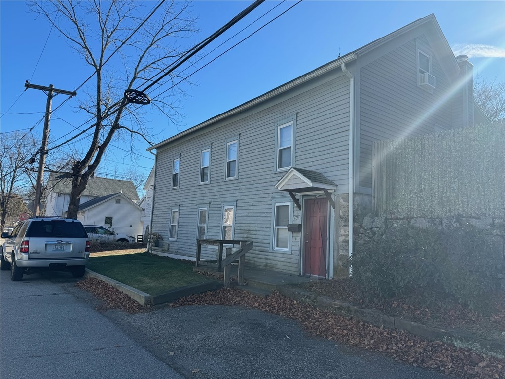 view of home's exterior with a yard