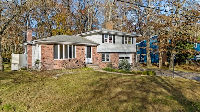 split level home with a front yard