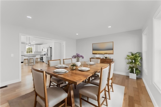 dining area with light wood-type flooring