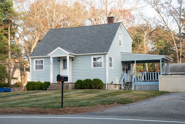 view of front of property featuring a porch and a front lawn