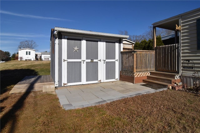 view of outdoor structure featuring a lawn