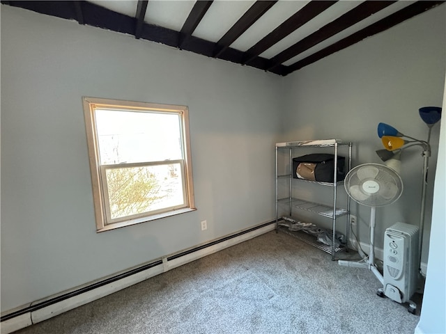 unfurnished room featuring beamed ceiling, carpet flooring, and a baseboard radiator