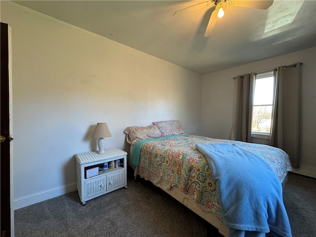 bedroom featuring ceiling fan and dark colored carpet