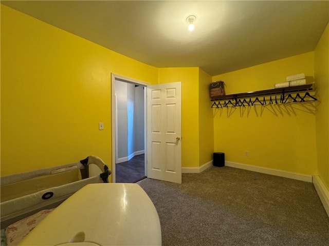 interior space with dark colored carpet